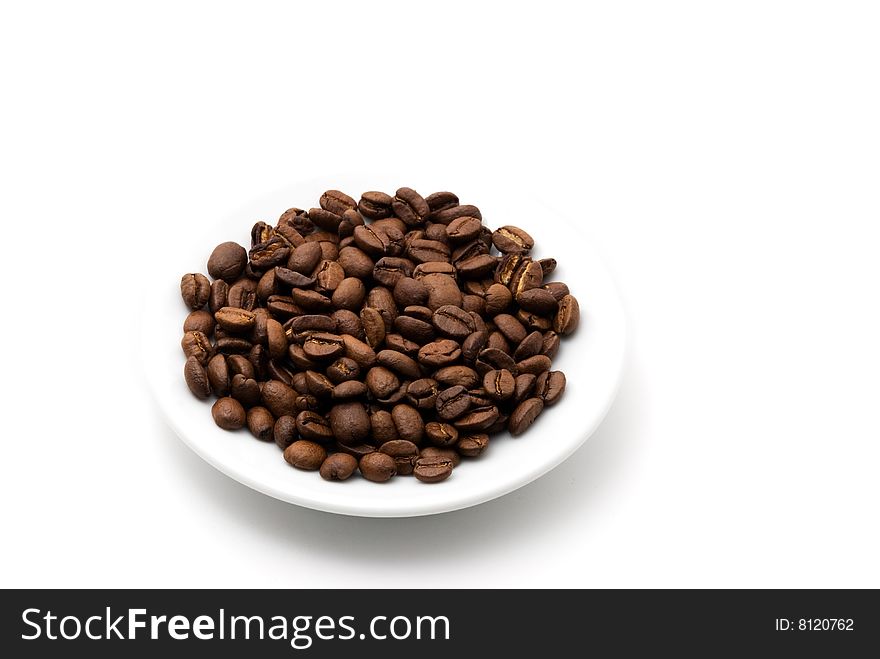 Saucer of coffee beans background