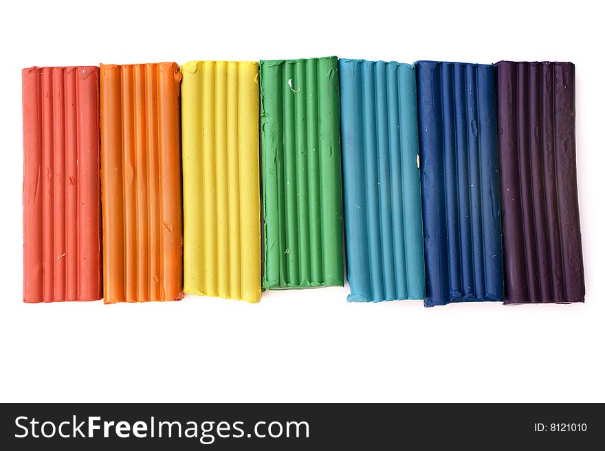 Color plasticine of colors of a rainbow isolated on white. Color plasticine of colors of a rainbow isolated on white