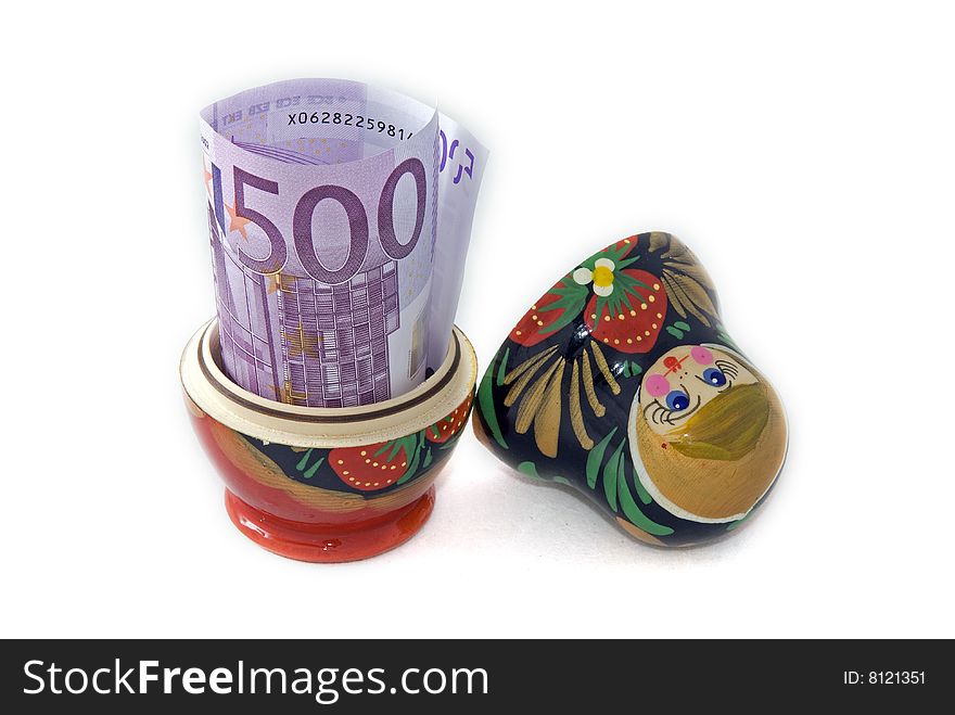 Russian doll with euro inside isolated on white background