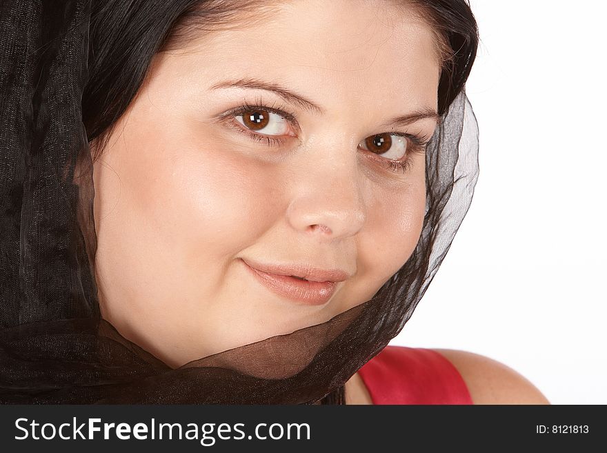 Full face photo of young female with veil covering part of the face