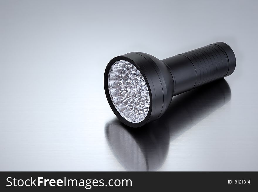 Black spotlight on gray clean metallic background. Black spotlight on gray clean metallic background