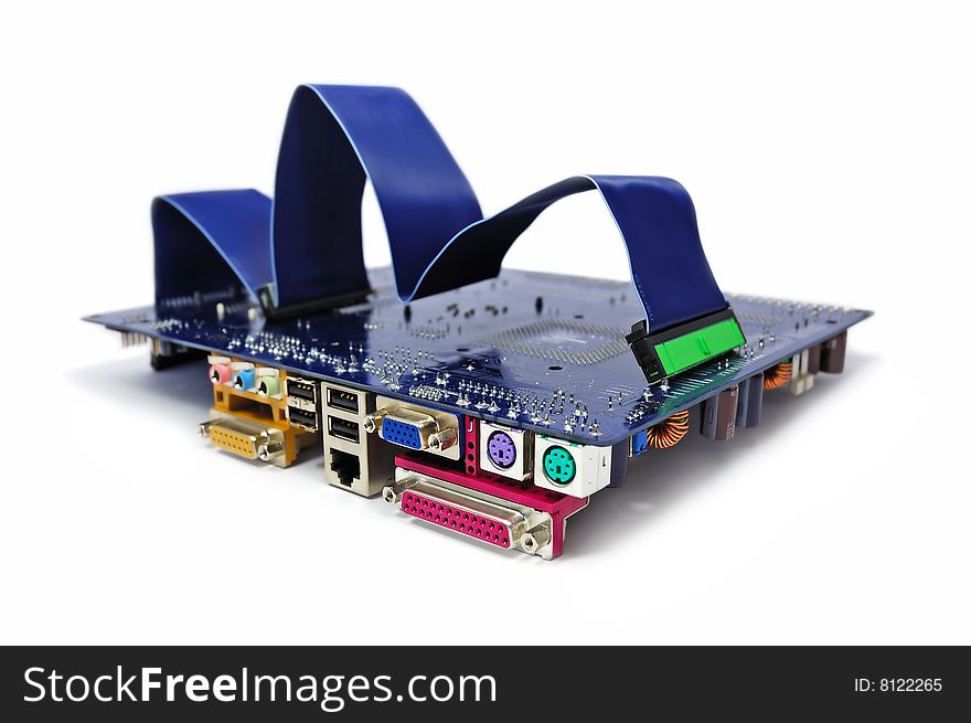 A computer motherboard with IDE cable on top on white background. Computer assembling concept. A computer motherboard with IDE cable on top on white background. Computer assembling concept.