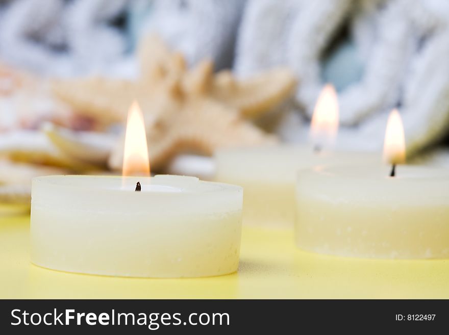 Candle on a yelow background