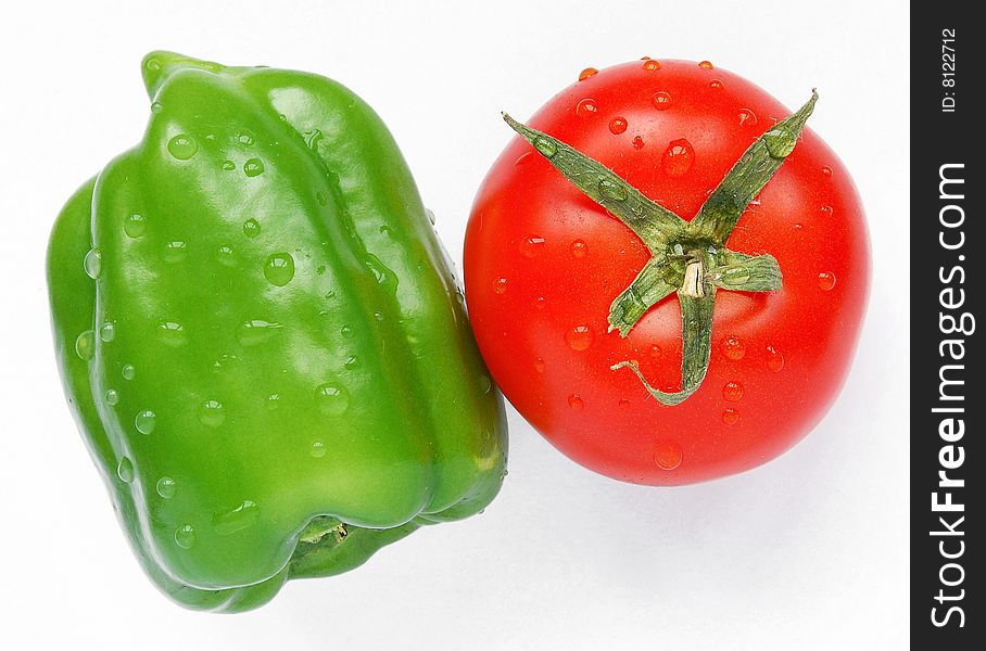 Green Pepper and Red Tomato on White Background. Green Pepper and Red Tomato on White Background