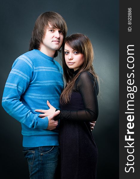 Young lovely couple, studio shot