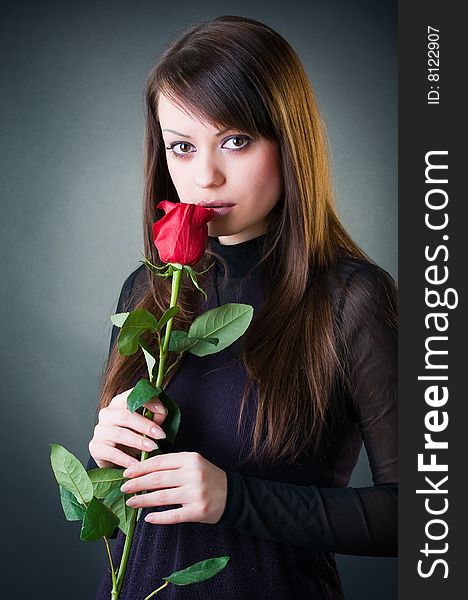 Sensual girl with rose, studio shot