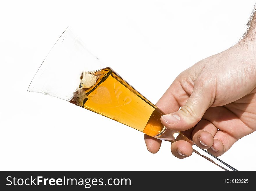 Hand holding a glass of champagne isolated on white