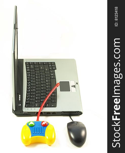 Laptop, mouse and a toy on white studio isolated background. Laptop, mouse and a toy on white studio isolated background.