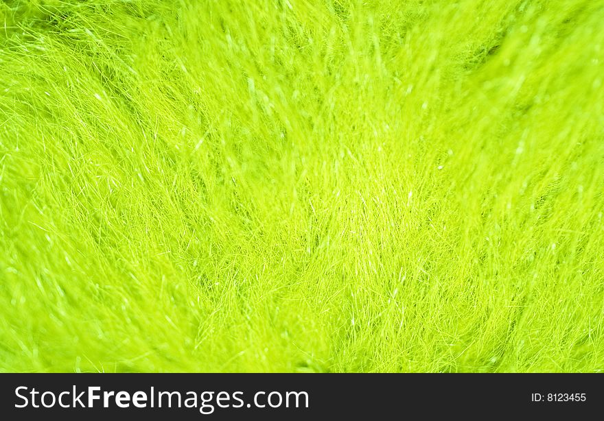 Blurred bright green grass (as an abstract summer background)