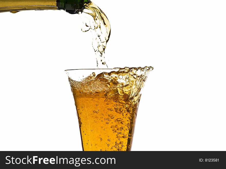 Pouring champagne isolated on white