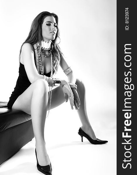 Black and white portrait of a  beautiful  fashion model sitting. Black and white portrait of a  beautiful  fashion model sitting