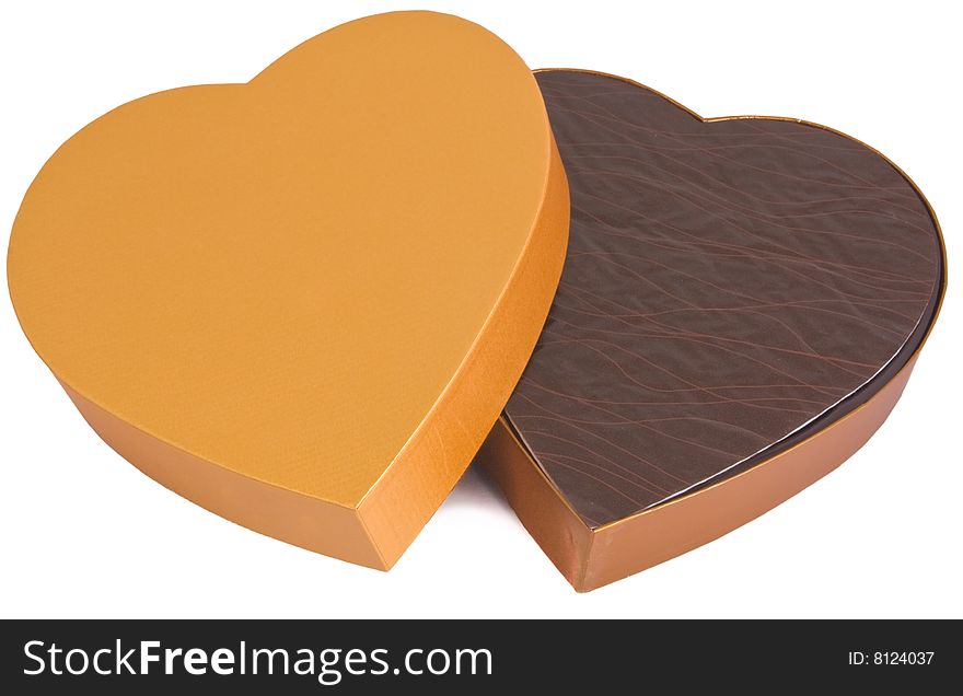 Half-open heart shaped golden chocolate box with copyspace isolated on white. Half-open heart shaped golden chocolate box with copyspace isolated on white