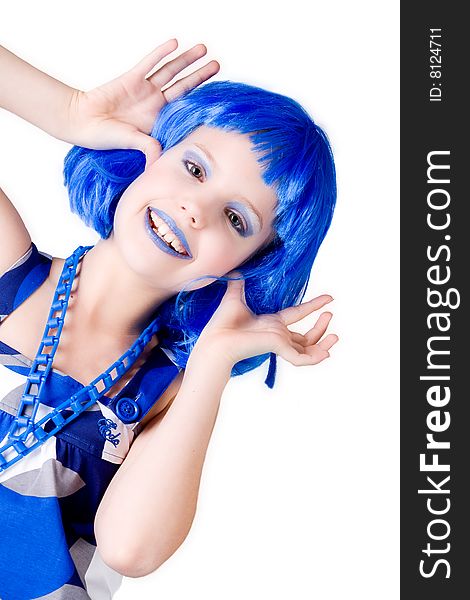 Young enthusiastic child with a blue wig shot on a white background. Young enthusiastic child with a blue wig shot on a white background