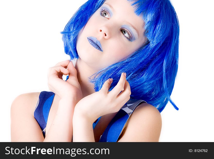 Young enthusiastic child with a blue wig shot on a white background. Young enthusiastic child with a blue wig shot on a white background