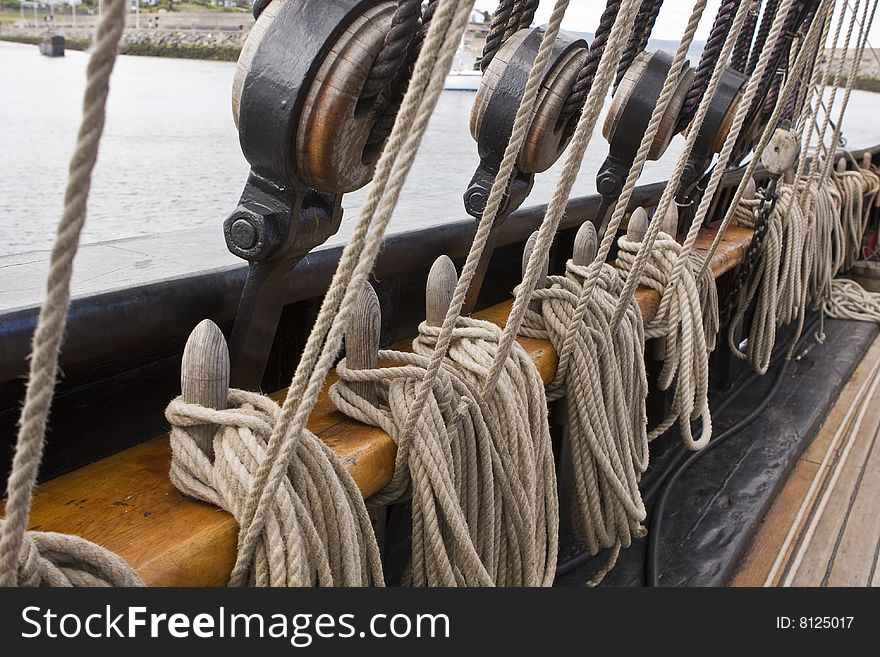 Old rigging along a side of an old tall ship. Old rigging along a side of an old tall ship