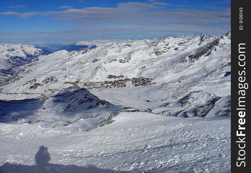 Picture from afar of the high altitude mountain ski resort of Val Thorens in the Three Valleys