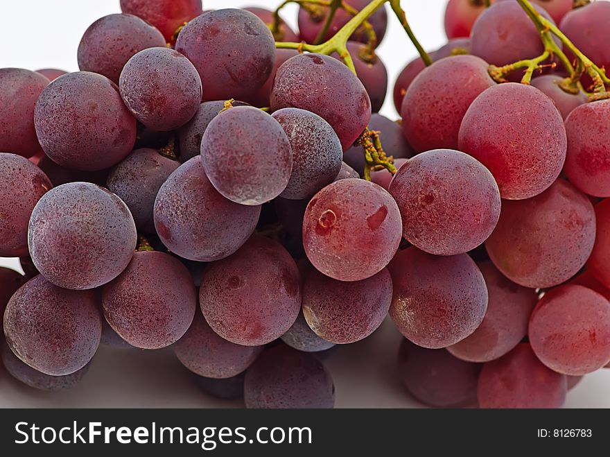 Fresh cluster grapes on white isolated