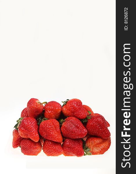 A box holds the fresh strawberries isolated on white background.