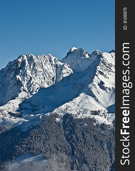 the white summits on the belledonne mountain in french alps. the white summits on the belledonne mountain in french alps