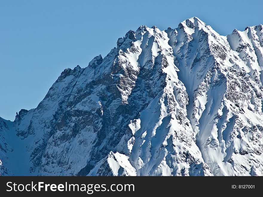 the white summits on the belledonne mountain in french alps. the white summits on the belledonne mountain in french alps