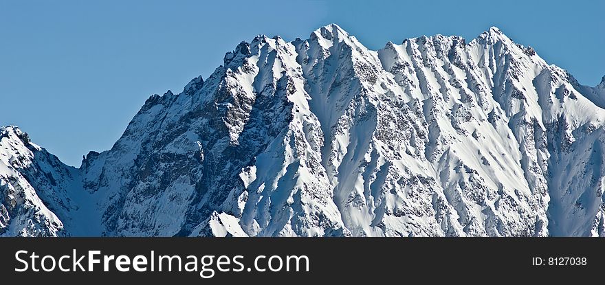 the white summits on the belledonne mountain in french alps. the white summits on the belledonne mountain in french alps