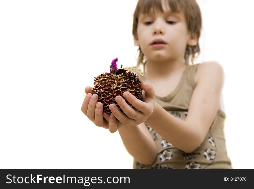 Young boy hold a decorative apple in his hand. Young boy hold a decorative apple in his hand