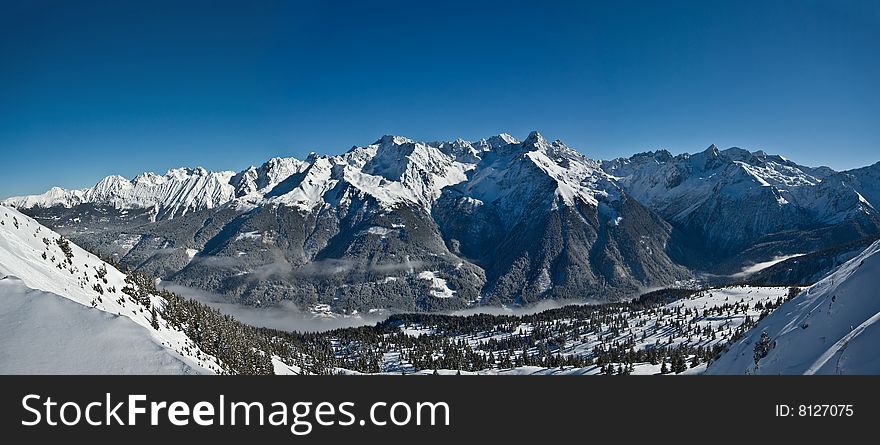 the white summits on the belledonne mountain in french alps. the white summits on the belledonne mountain in french alps