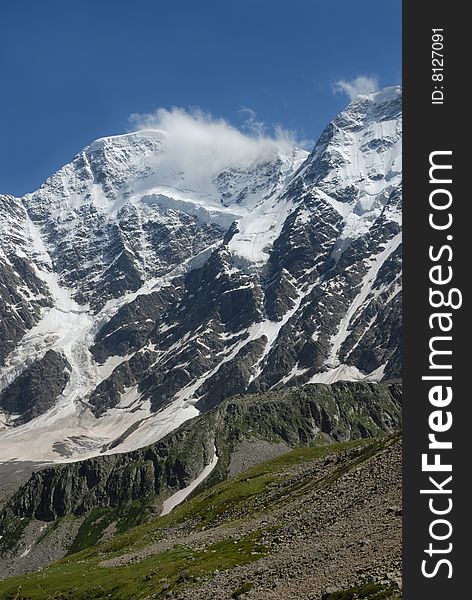 Winter scene of the tall mountain covered by snow. Winter scene of the tall mountain covered by snow