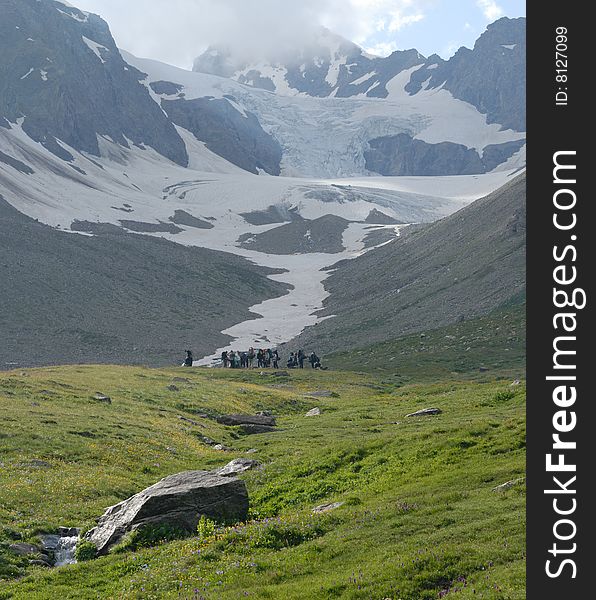 Group of tourists in highland of the Caucasus