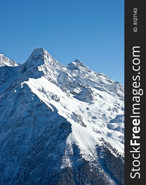 the white summits on the belledonne mountain in french alps. the white summits on the belledonne mountain in french alps