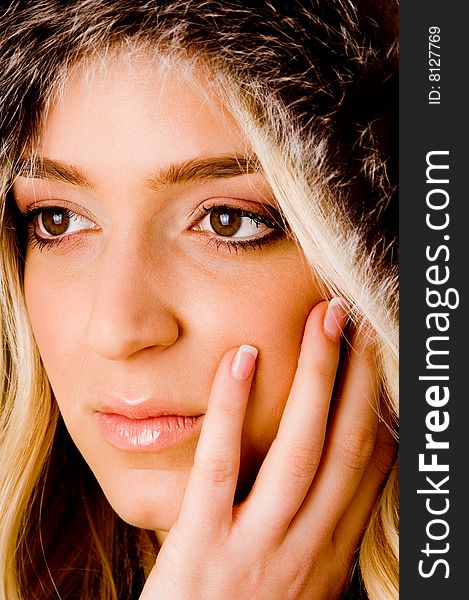 Side view of beautiful woman looking at camera on an isolated white background