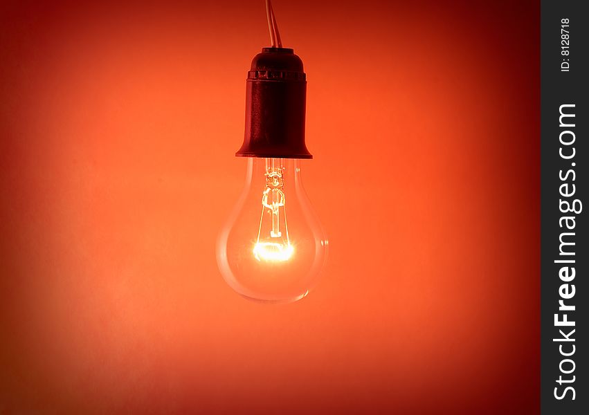 Photo of light bulb on red background