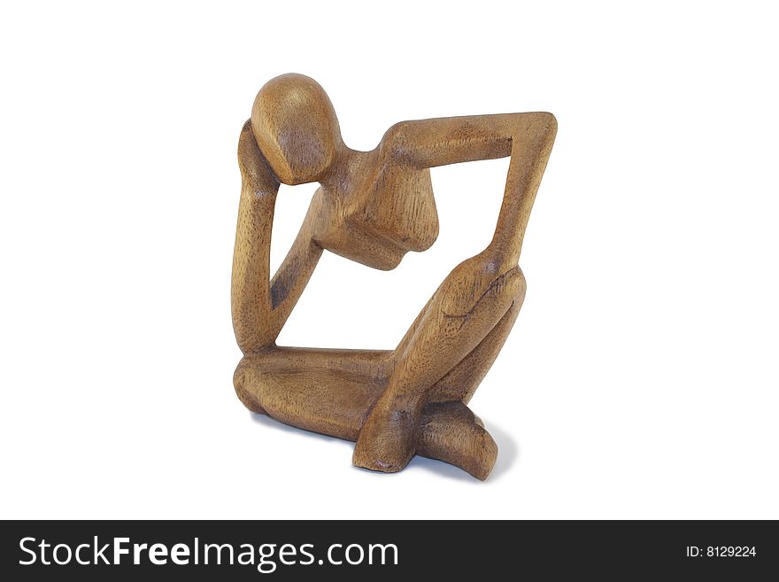 Wooden figurine on a white background