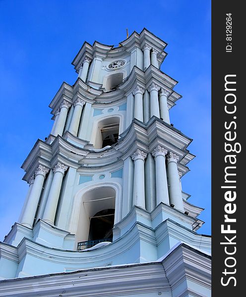 White church belfry under blue sky