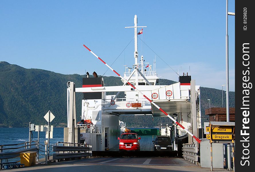 Ferry unloading cars on a fjord  in Norway