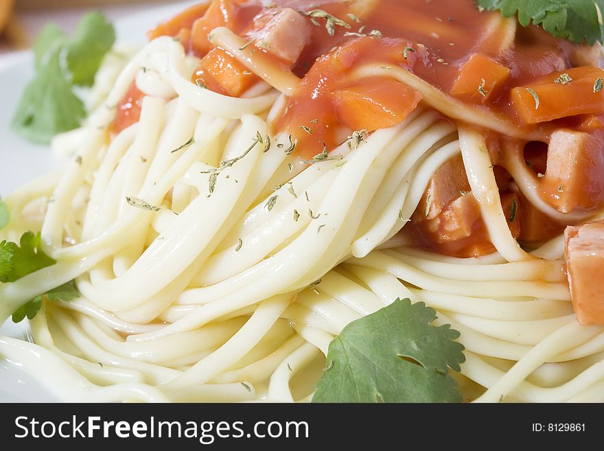 Close up shot of freshly cooked spaghetti with tomatoes sauce. Close up shot of freshly cooked spaghetti with tomatoes sauce