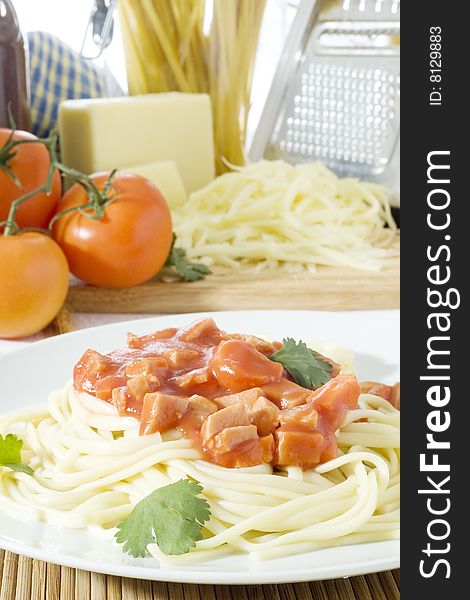 Close up shot of spaghetti on a white plate