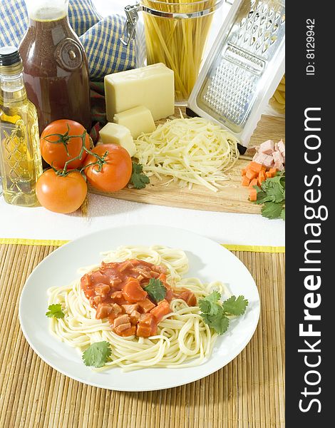 Overhead shot of a table top with spaghetti in plate. Overhead shot of a table top with spaghetti in plate