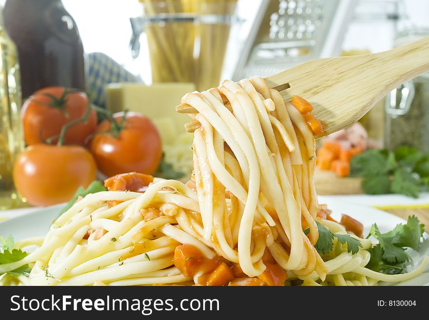 Close up shot of spaghetti on wooden fork. Close up shot of spaghetti on wooden fork