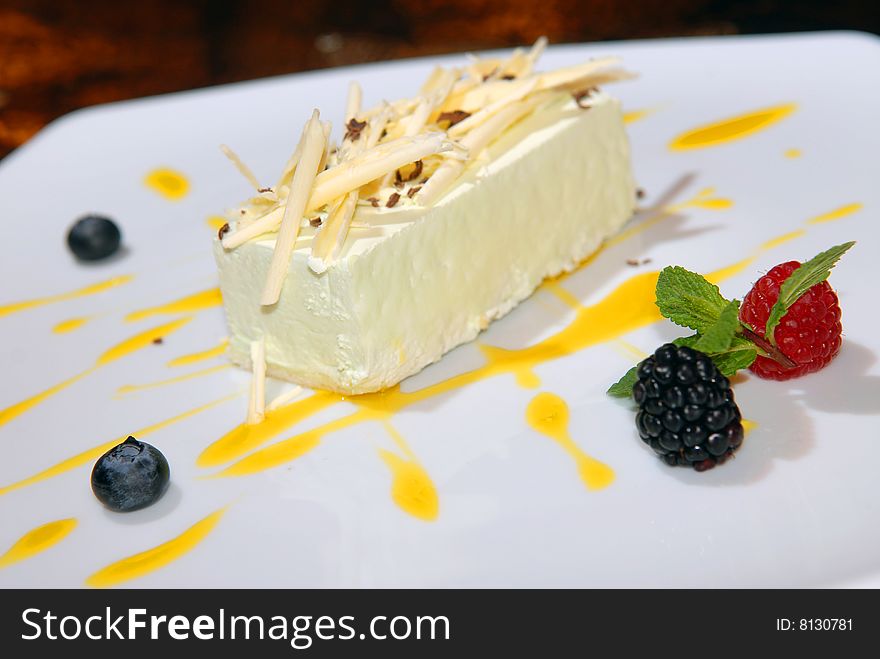 Mango souffle with white chocolate and berries