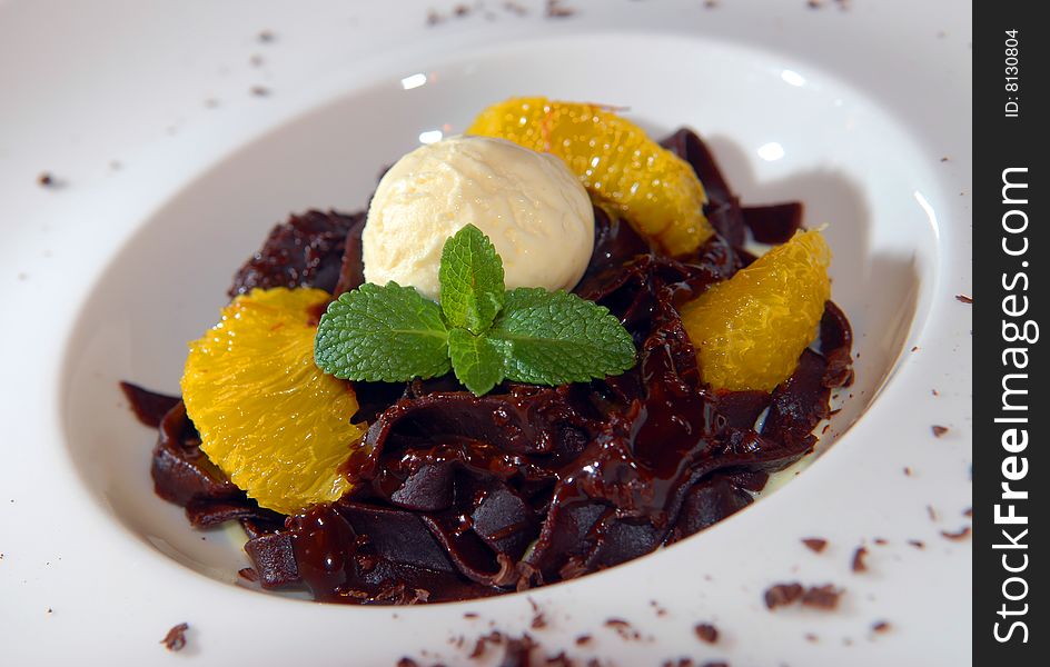 Chocolate paste with ice-cream and oranges