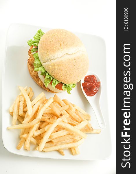 Crisp chicken burger with tomato onion cheese lettuce isolated. Crisp chicken burger with tomato onion cheese lettuce isolated
