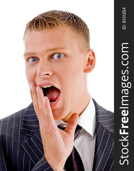 Close up view of amazed business man against white background