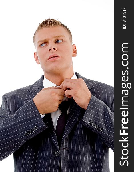 Young businessman tucking the button on an isolated white background