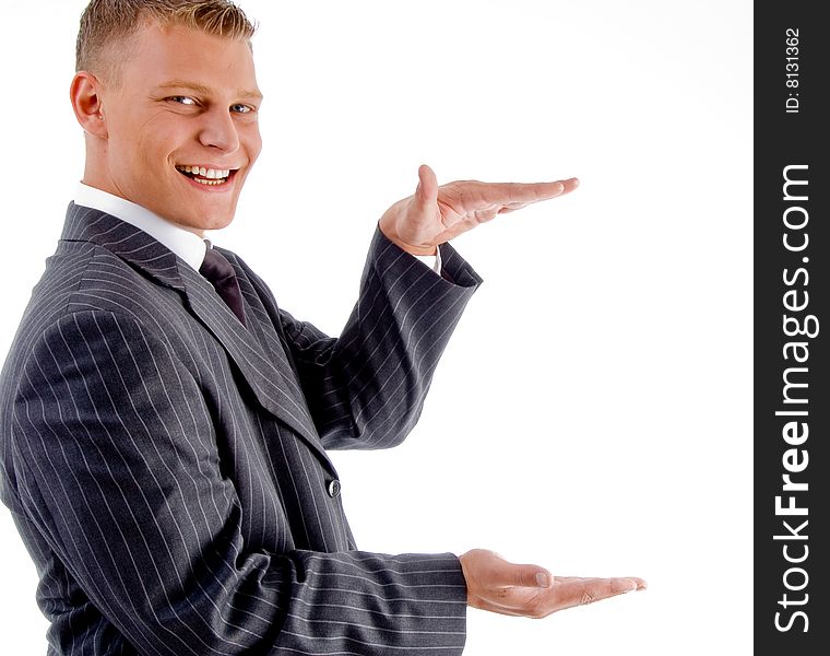 Young smiling businessman measuring on an isolated white background