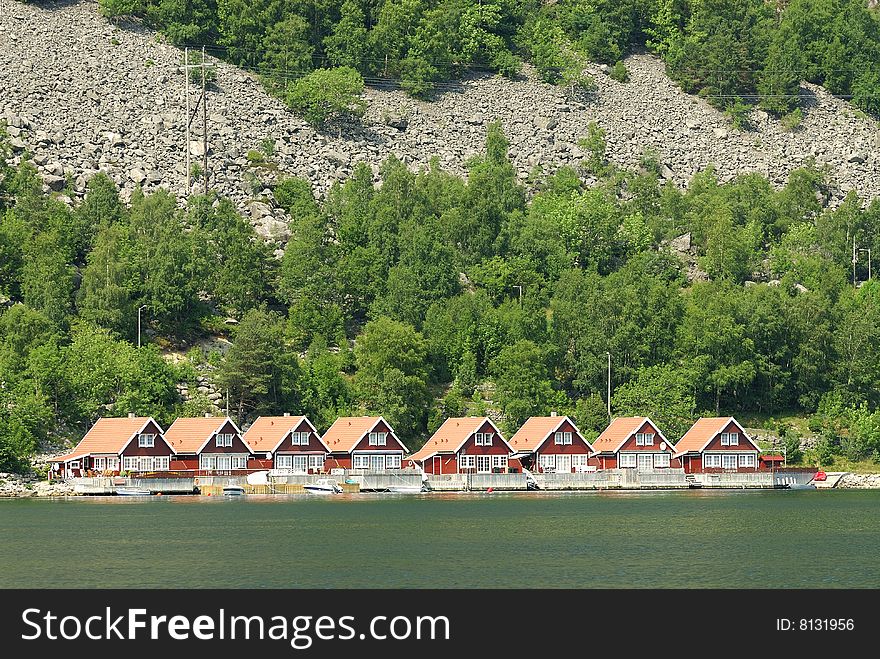 Red houses on the Norwegian shore. Red houses on the Norwegian shore