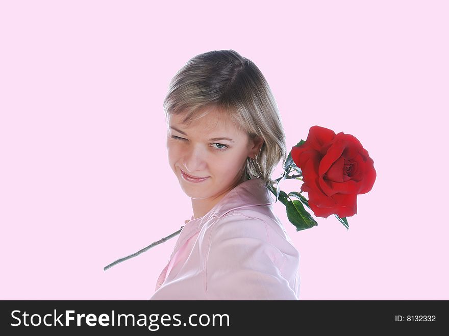 Beautiful young blonde posing with the rose in her hand. Beautiful young blonde posing with the rose in her hand
