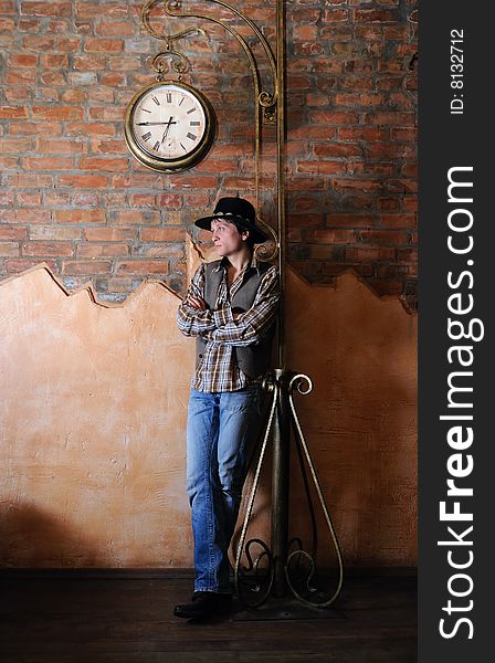 The guy in a cowboy's hat stands under hours. The participant of group StockDog. The guy in a cowboy's hat stands under hours. The participant of group StockDog