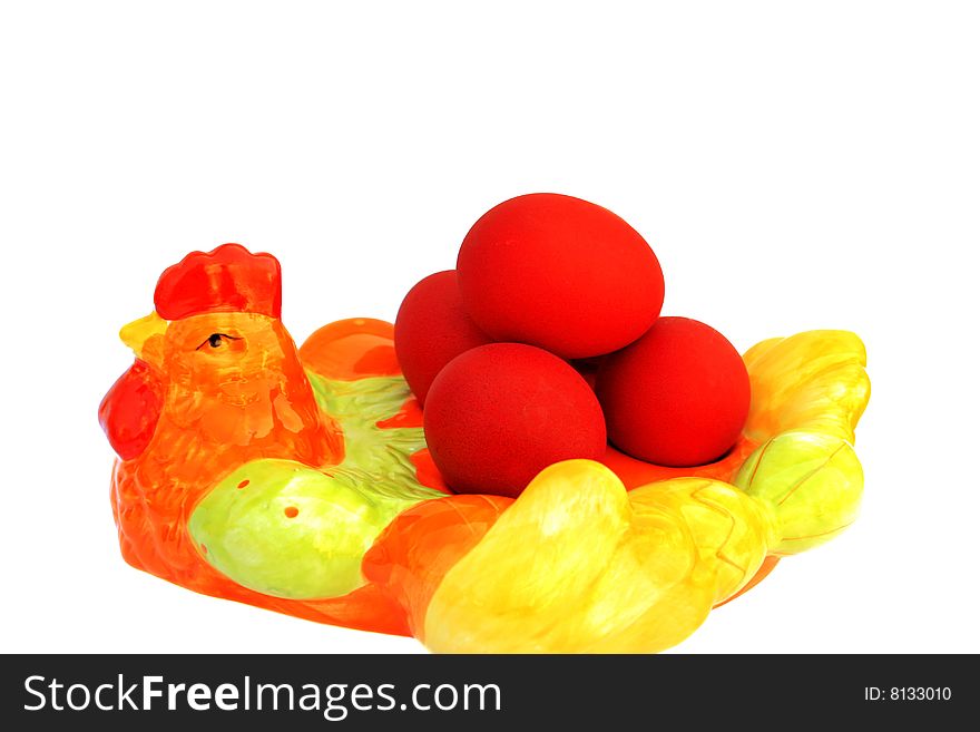 Easter red eggs on the cock on white background.