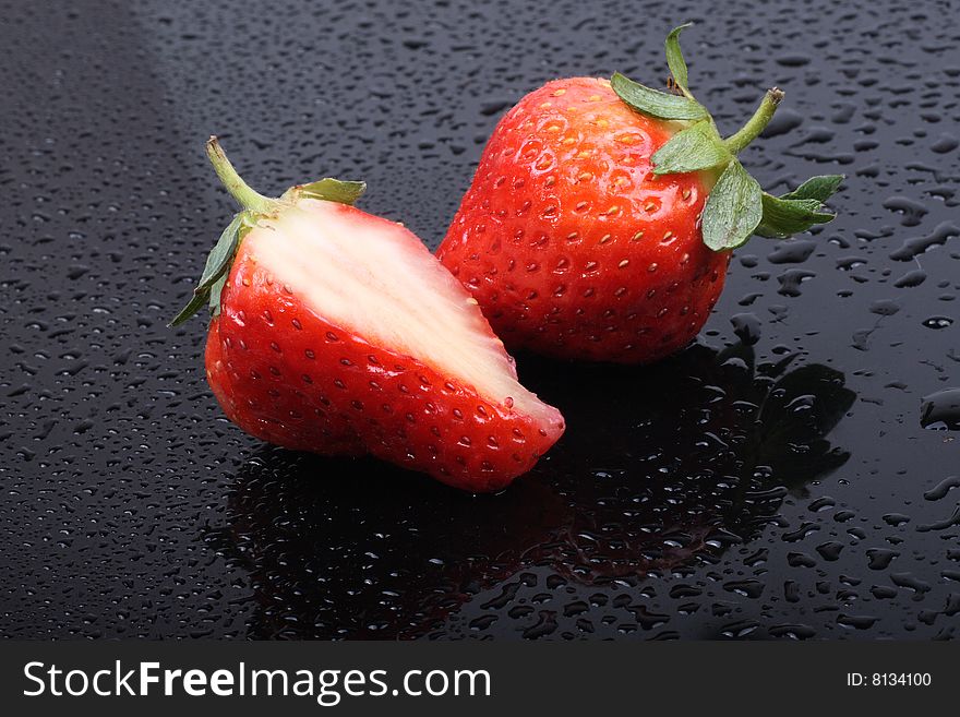 Fresh ripe strawberries  on the dark background.